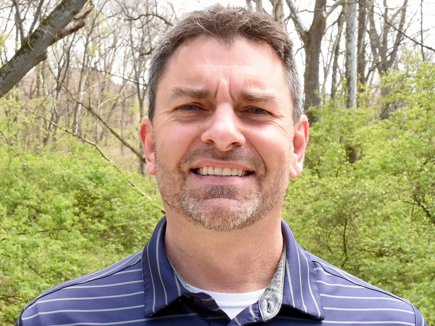 Close-up professional headshot of Randy Nauman at Summit in Cincinnati, OH, smiling outdoors.