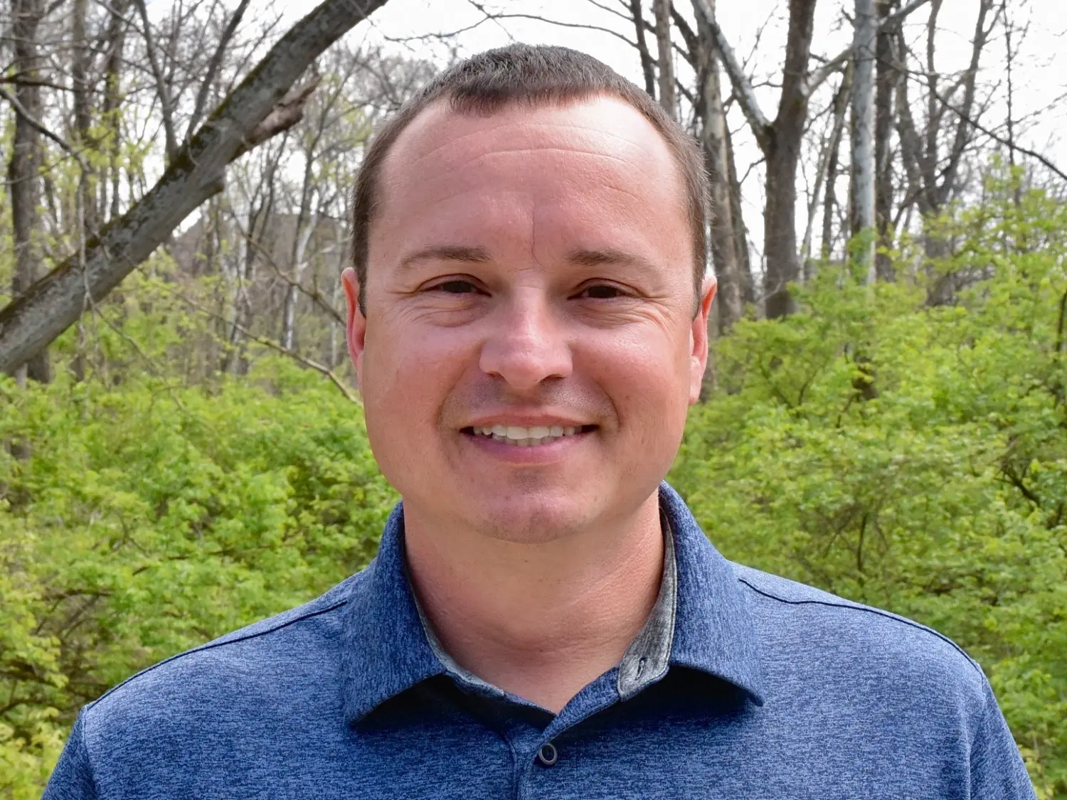 Close-up professional headshot of owner Scott McFall at Summit in Cincinnati, OH, smiling outdoors.